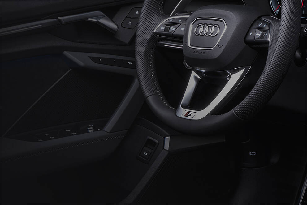 HMI Solutions for Automotive Applications with Capacitive Sensors Audi steering wheel with touch control elements in interior design