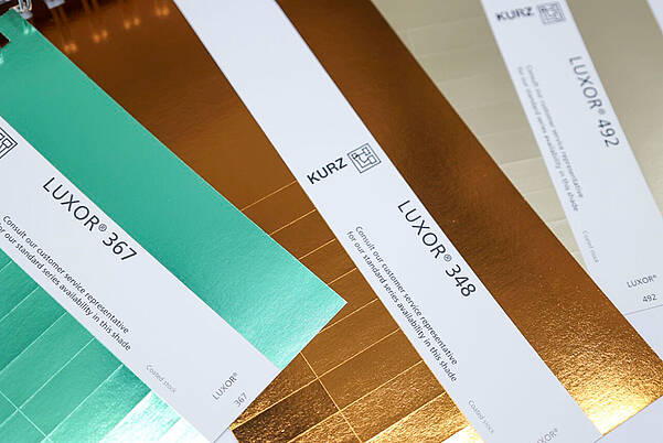 Unleash Your Creativity in Narrow Web Printing Metallic green & golden hot-stamping foils LUXOR®/ALUFIN®