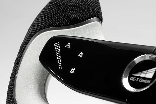 The Steering Wheel of Tomorrow: Rethinking Mobility with LEONHARD KURZ Steering wheel for GE-T with futuristic controls by LEONHARD KURZ